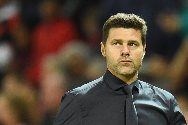 Tottenham Hotspur's Argentinian head coach Mauricio Pochettino leaves the pitch at half-time during the English Premier League football match between Manchester United and Tottenham Hotspur at Old Trafford in Manchester, north west England, on August 27, 2018. (Photo by Oli SCARFF / AFP) / RESTRICTED TO EDITORIAL USE. No use with unauthorized audio, video, data, fixture lists, club/league logos or 'live' services. Online in-match use limited to 120 images. An additional 40 images may be used in extra time. No video emulation. Social media in-match use limited to 120 images. An additional 40 images may be used in extra time. No use in betting publications, games or single club/league/player publications. /         (Photo credit should read OLI SCARFF/AFP/Getty Images)