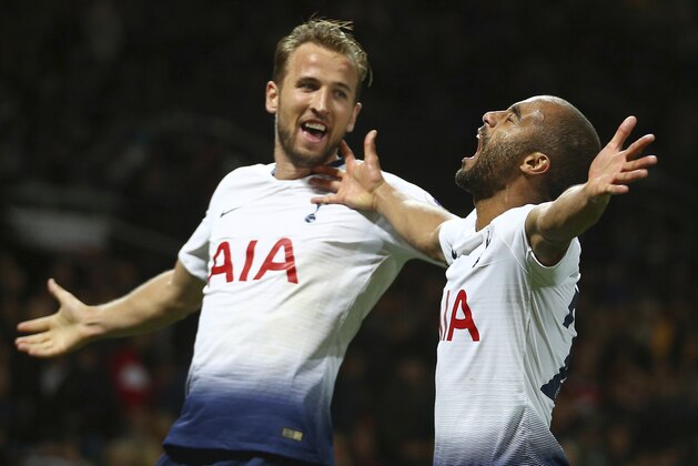 Tottenham Hotspur's Lucas Moura celebrates with Harry Kane scoring his side's third goal during the English Premier League soccer match between Manchester United and Tottenham Hotspur at Old Trafford stadium in Manchester, England, Monday, Aug. 27, 2018. (AP Photo/Dave Thompson)