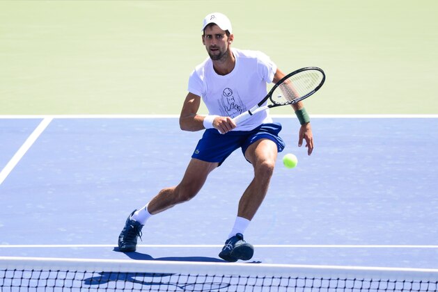 NEW YORK, NY - AUGUST 23: Novak Djokovic of Serbia practices with Alexander Zverev of Germany before the start of the US Open at the USTA Billie Jean King National Tennis Centre on August 23, 2018 in New York City, United States. (Photo by TPN/Getty Images)
