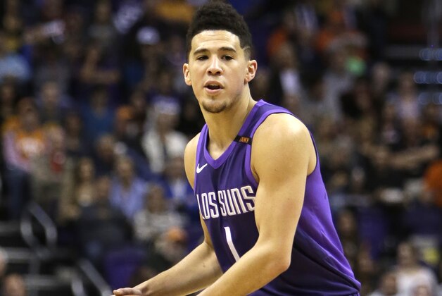 Phoenix Suns guard Devin Booker (1) in the first half during an NBA basketball game against the New York Knicks, Friday, Jan. 26, 2018, in Phoenix. (AP Photo/Rick Scuteri)