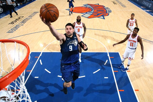 NEW YORK, NY - APRIL 3:  Nikola Vucevic #9 of the Orlando Magic goes to the basket against the New York Knicks on April 3, 2018 at Madison Square Garden in New York City, New York.  NOTE TO USER: User expressly acknowledges and agrees that, by downloading and or using this photograph, User is consenting to the terms and conditions of the Getty Images License Agreement. Mandatory Copyright Notice: Copyright 2018 NBAE  (Photo by Nathaniel S. Butler/NBAE via Getty Images)