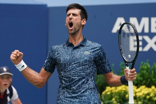 Novak Djokovic of Serbia wins the 3rd set against Marton Fucsovics of Hungary during their Day 2 of the US Open Men's Singles match at the USTA Billie Jean King National Tennis Center in New York on August 28, 2018. (Photo by TIMOTHY A. CLARY / AFP)        (Photo credit should read TIMOTHY A. CLARY/AFP/Getty Images)