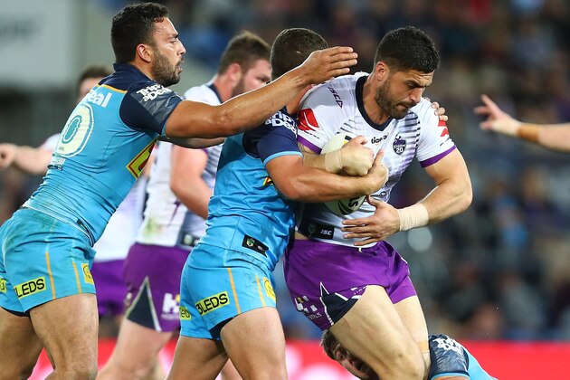 GOLD COAST, AUSTRALIA - AUGUST 25:  Jesse Bromwich of the Storm is tackled during the round 24 NRL match between the Gold Coast Titans and the Melbourne Storm at Cbus Super Stadium on August 25, 2018 in Gold Coast, Australia.  (Photo by Chris Hyde/Getty Images)