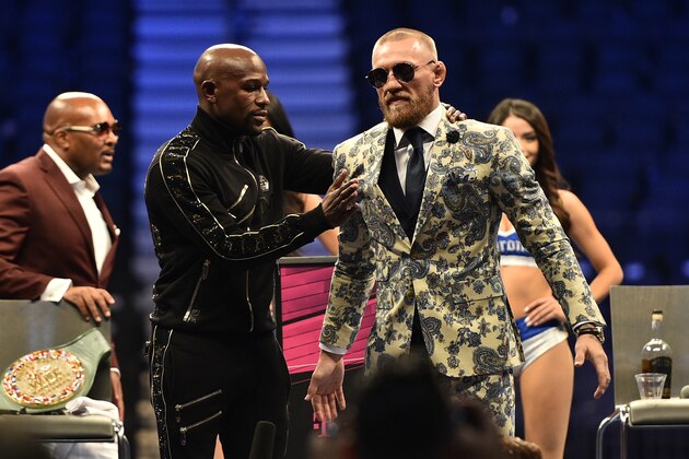LAS VEGAS, NV - AUGUST 26:  (L-R) Floyd Mayweather Jr. and Conor McGregor attend a news conference after Mayweather defeated Conor McGregor by 10th-round TKO in their super welterweight boxing match at T-Mobile Arena on August 26, 2017 in Las Vegas, Nevada. (Photo by Jeff Bottari/Zuffa LLC/Zuffa LLC via Getty Images)