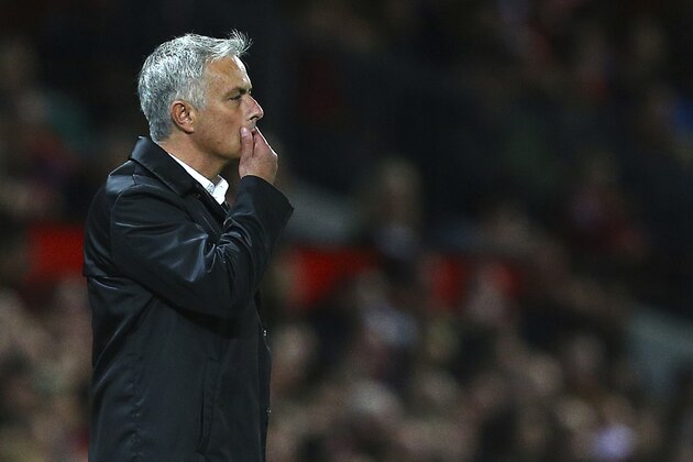 Manchester United manager Jose Mourinho stands on the touchline during the English Premier League soccer match between Manchester United and Tottenham Hotspur at Old Trafford stadium in Manchester, England, Monday, Aug. 27, 2018. (AP Photo/Dave Thompson)