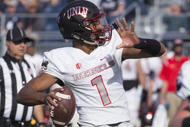 UNLV quarterback Armani Rogers throws against Nevada in the first half of an NCAA college football game in Reno, Nev., Saturday, November 25, 2017. (AP Photo/Tom R. Smedes)