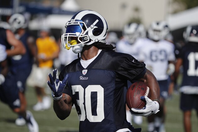 Los Angeles Rams running back Todd Gurley carries the ball during NFL football practice, Thursday, July 26, 2018, in Irvine, Calif. (AP Photo/Jae C. Hong)