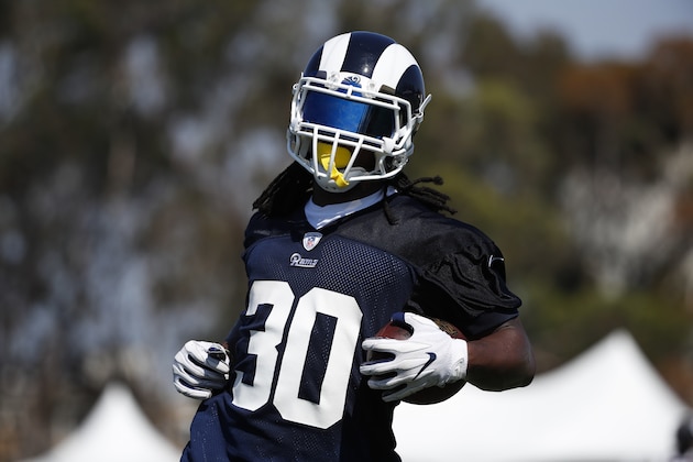 Los Angeles Rams running back Todd Gurley carries the ball during NFL football practice, Friday, July 27, 2018, in Irvine, Calif. (AP Photo/Jae C. Hong)