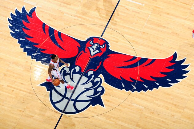 ATLANTA, GA - NOVEMBER 26:  Jeff Teague #0 of the Atlanta Hawks takes the ball up court across the Hawks logo during the game against the Orlando Magic on November 26, 2013 at Philips Arena in Atlanta, Georgia.  NOTE TO USER: User expressly acknowledges and agrees that, by downloading and/or using this Photograph, user is consenting to the terms and conditions of the Getty Images License Agreement. Mandatory Copyright Notice: Copyright 2013 NBAE (Photo by Scott Cunningham/NBAE via Getty Images)