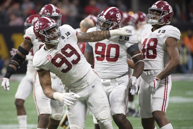 ATLANTA, GA - JANUARY 08: Raekwon Davis #99 of the Alabama Crimson Tide celebrates a tackle against the Georgia Bulldogs during the College Football Playoff National Championship held at Mercedes-Benz Stadium on January 8, 2018 in Atlanta, Georgia. Alabama defeated Georgia 26-23 for the national title. (Photo by Jamie Schwaberow/Getty Images) ATLANTA, GA - JANUARY 08: Raekwon Davis #99 of the Alabama Crimson Tide celebrates a tackle against the Georgia Bulldogs during the College Football Playoff National Championship held at Mercedes-Benz Stadium on January 8, 2018 in Atlanta, Georgia. Alabama defeated Georgia 26-23 for the national title. (Photo by Jamie Schwaberow/Getty Images)