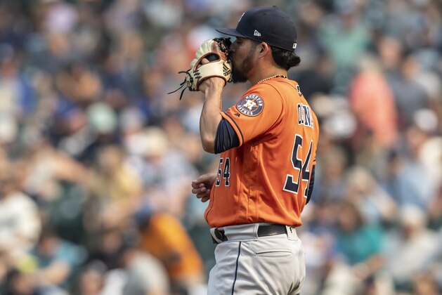 SEATTLE, WA - AUGUST 22: Relief pitcher Roberto Osuna #54 of the Houston Astros kisses his glove after a game against the Seattle Mariners at Safeco Field on August 22, 2018 in Seattle, Washington. The Astros won the game 10-7. (Photo by Stephen Brashear/Getty Images)