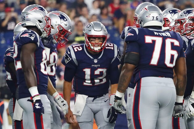 FOXBOROUGH, MA - AUGUST 16:  Tom Brady #12 of the New England Patriots huddles with teammates in the first half against the Philadelphia Eagles during the preseason game at Gillette Stadium on August 16, 2018 in Foxborough, Massachusetts.  (Photo by Tim Bradbury/Getty Images)