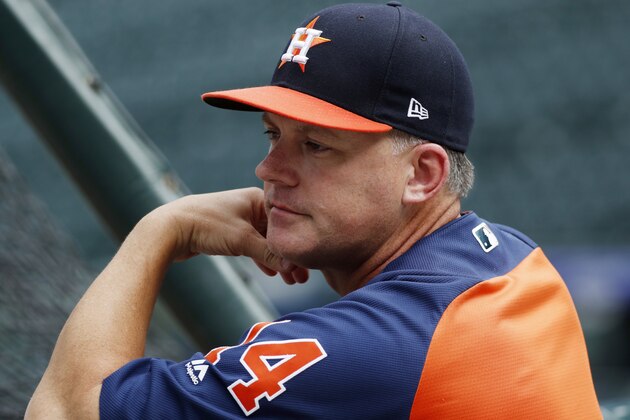 Houston Astros manager AJ Hinch watches batting practice before the team's baseball game against the Colorado Rockies on Wednesday, July 25, 2018, in Denver. (AP Photo/David Zalubowski)