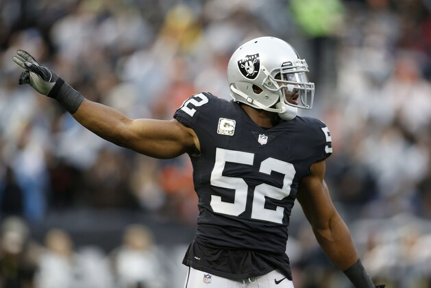 Oakland Raiders defensive end Khalil Mack (52) gestures during the first half of an NFL football game against the Denver Broncos in Oakland, Calif., Sunday, Nov. 26, 2017. (AP Photo/D. Ross Cameron)