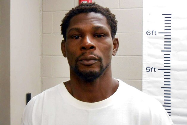 This booking photo released by the Maumelle Police Department shows Jermain Taylor. Police in the Little Rock suburb of Maumelle, Ark., say Taylor 38, and a former middleweight boxing champion, was arrested at his home around 3 a.m. Tuesday after allegedly biting a woman’s arm and face and threatening to kill her.  He was later released. Taylor  is currently serving a six-year suspended sentence after pleading guilty to nine felony charges in 2015, including a shooting that critically wounded his cousin, Tyrone DaWayne Hinton.. (Maumelle Police Department via AP)