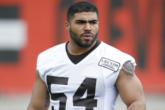 Cleveland Browns linebacker Mychal Kendricks stretches during the team's organized team activity at its NFL football training facility Tuesday, June 5, 2018, in Berea, Ohio. (AP Photo/Ron Schwane)