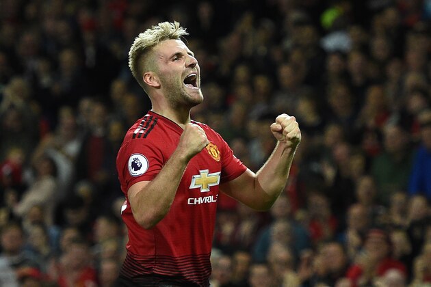 Manchester United's English defender Luke Shaw celebrates scoring the team's second goal during the English Premier League football match between Manchester United and Leicester City at Old Trafford in Manchester, north west England, on August 10, 2018. (Photo by Oli SCARFF / AFP) / RESTRICTED TO EDITORIAL USE. No use with unauthorized audio, video, data, fixture lists, club/league logos or 'live' services. Online in-match use limited to 120 images. An additional 40 images may be used in extra time. No video emulation. Social media in-match use limited to 120 images. An additional 40 images may be used in extra time. No use in betting publications, games or single club/league/player publications /         (Photo credit should read OLI SCARFF/AFP/Getty Images)