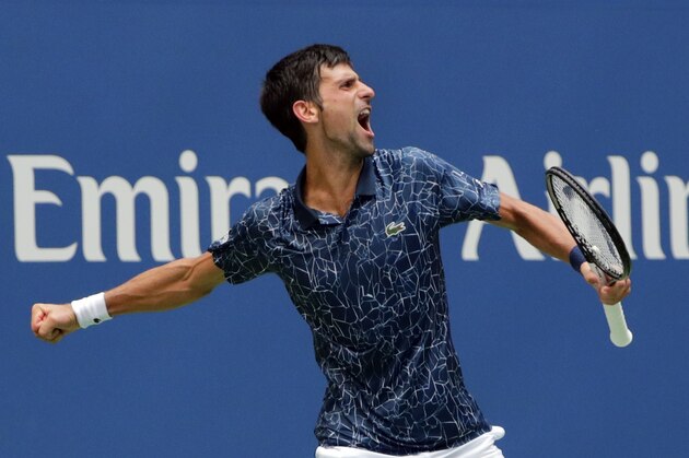 Novak Djokovic, of Serbia, celebrates after winning the third set against Marton Fucsovics, of Hungary, during the first round of the U.S. Open tennis tournament, Tuesday, Aug. 28, 2018, in New York. (AP Photo/Frank Franklin II)