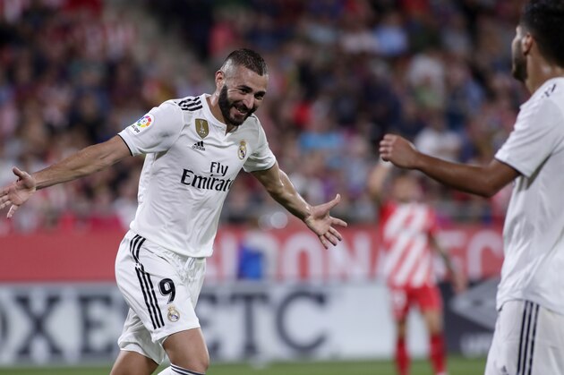 Real Madrid's Karim Benzema celebrates scoring his side's 4th goal during the Spanish La Liga soccer match between Girona and Real Madrid at the Montilivi stadium in Girona, Sunday, Aug. 26, 2018. (AP Photo/Eric Alonso)