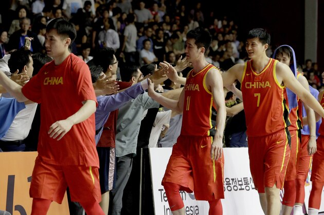 Chinese team celebrate after defeating the Philippines 82-80 in their men's basketball game at the 18th Asian Games in Jakarta, Indonesia on Tuesday, Aug. 21, 2018. (AP Photo/Aaron Favila)