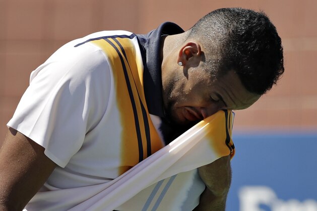 Nick Kyrgios, of Australia, wipes his face during a match against Pierre-Hugues Herbert, of France, during the second round of the U.S. Open tennis tournament, Thursday, Aug. 30, 2018, in New York. (AP Photo/Seth Wenig)