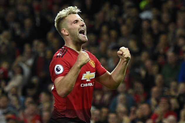 Manchester United's English defender Luke Shaw celebrates scoring the team's second goal during the English Premier League football match between Manchester United and Leicester City at Old Trafford in Manchester, north west England, on August 10, 2018. (Photo by Oli SCARFF / AFP) / RESTRICTED TO EDITORIAL USE. No use with unauthorized audio, video, data, fixture lists, club/league logos or 'live' services. Online in-match use limited to 120 images. An additional 40 images may be used in extra time. No video emulation. Social media in-match use limited to 120 images. An additional 40 images may be used in extra time. No use in betting publications, games or single club/league/player publications /         (Photo credit should read OLI SCARFF/AFP/Getty Images)