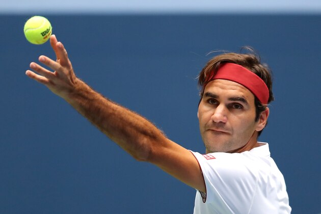 NEW YORK, NY - AUGUST 30:  Roger Federer of Switzerland serves the ball during his men's singles second round match against Benoit Paire of France on Day Four of the 2018 US Open at the USTA Billie Jean King National Tennis Center on August 30, 2018 in the Flushing neighborhood of the Queens borough of New York City.  (Photo by Elsa/Getty Images)