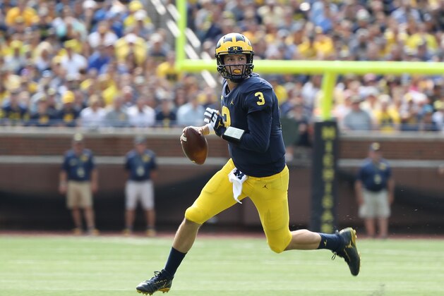 ANN ARBOR, MI - SEPTEMBER 16: Wilton Speight #3 of the Michigan Wolverines rolls out to pass during the third quarter of the game against the Air Force Falcons at Michigan Stadium on September 16, 2017 in Ann Arbor, Michigan. Michigan defeated Air Force Falcons 29-13. (Photo by Leon Halip/Getty Images)