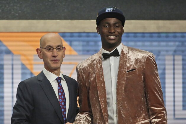 Michigan State's Jaren Jackson Jr. right, poses with NBA Commissioner Adam Silver after he was picked fourth overall by the Memphis Grizzlies during the NBA basketball draft in New York, Thursday, June 21, 2018. (AP Photo/Kevin Hagen)