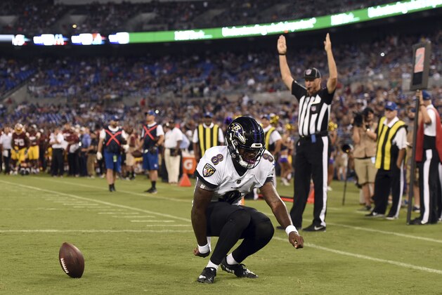 Baltimore Ravens quarterback Lamar Jackson celebrates after rushing for a touchdown in the first half of a preseason NFL football game against the Washington Redskins, Thursday, Aug. 30, 2018, in Baltimore. (AP Photo/Gail Burton)