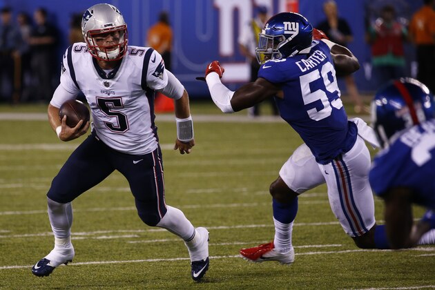 EAST RUTHERFORD, NJ - AUGUST 30:  Danny Etling #5 of the New England Patriots rolls out against the New York Giants during a pre-season NFL game at MetLife Stadium on August 30, 2018 in East Rutherford, New Jersey. (Photo by Jeff Zelevansky/Getty Images)