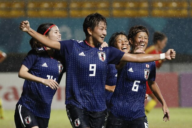 Japan's Sugasawa Yuika, center, celebrate after score during women soccer final match at the 18th Asian Games in Palembang, Indonesia, Friday, Aug. 31, 2018. (AP Photo/Vincent Thian)