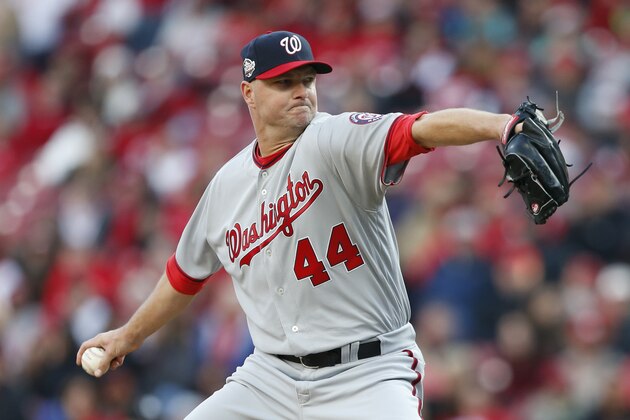 Washington Nationals relief pitcher Ryan Madson throws in the eighth inning of an opening day baseball game against the Cincinnati Reds, Friday, March 30, 2018, in Cincinnati. (AP Photo/Gary Landers)