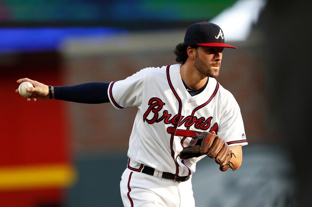 Atlanta Braves shortstop Dansby Swanson (7) warms up before the first inning of a baseball game against the New York Mets Wednesday, May 30, 2018, in Atlanta. (AP Photo/John Bazemore)