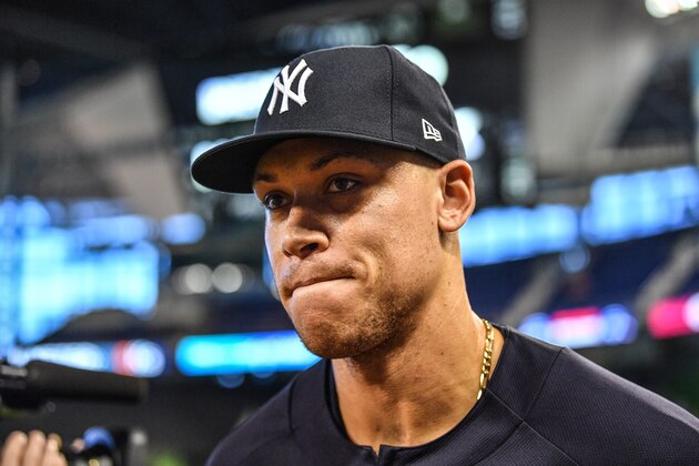 MIAMI, FL - AUGUST 21: Aaron Judge #99 of the New York Yankees sings autographs before the game against the Miami Marlins at Marlins Park on August 21, 2018 in Miami, Florida. (Photo by Mark Brown/Getty Images)