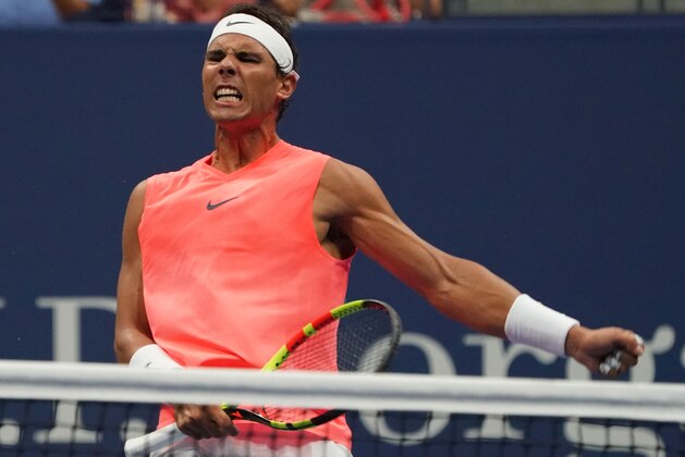 Rafael Nadal of Spain celebrates winning the second set against Karen Khachanov of Russia during their 2018 US Open men's round 3 match August 31, 2018 in New York. (Photo by Don EMMERT / AFP)        (Photo credit should read DON EMMERT/AFP/Getty Images)