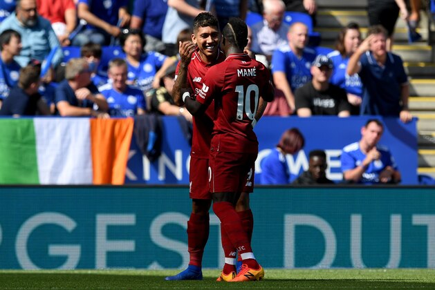 LEICESTER, ENGLAND - SEPTEMBER 01:  Roberto Firmino of Liverpool celebrates after scoring his team's second goal with Sadio Mane during the Premier League match between Leicester City and Liverpool FC at The King Power Stadium on September 1, 2018 in Leicester, United Kingdom.  (Photo by Shaun Botterill/Getty Images)