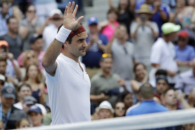 Roger Federer, of Switzerland, waves after defeating Benoit Paire, of France, during the second round of the U.S. Open tennis tournament, Thursday, Aug. 30, 2018, in New York. (AP Photo/Kevin Hagen)