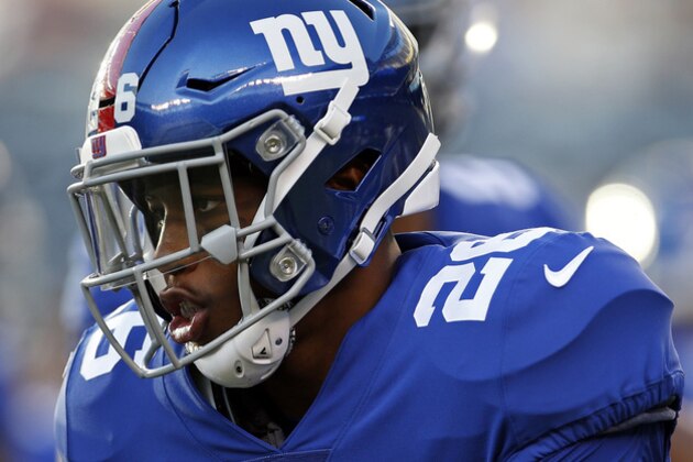 New York Giants running back Saquon Barkley (26) warms up before a preseason NFL football game Thursday, Aug. 9, 2018, in East Rutherford, N.J. (AP Photo/Adam Hunger)