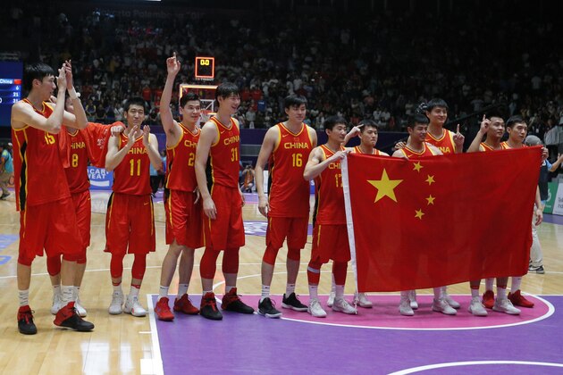 Team China celebrates after winning their men's basketball gold medal match against Iran at the 18th Asian Games in Jakarta, Indonesia, Saturday, Sept. 1, 2018. (AP Photo/Dita Alangkara)