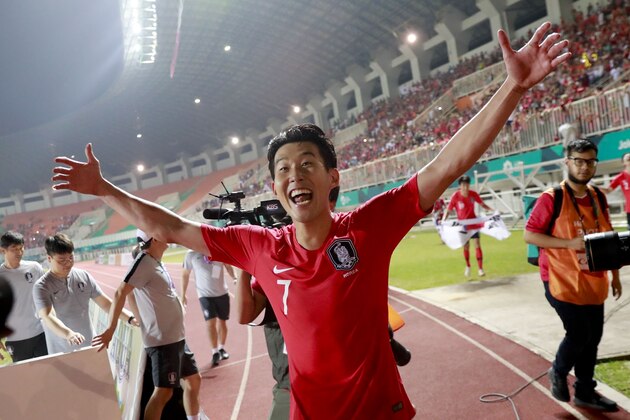 South Korea's Son Heung-min celebrates after winning Japan during the soccer men's gold medal match at the 18th Asian Games in Bogor, Indonesia, Saturday, Sept. 1, 2018. (AP Photo/Bernat Armangue)