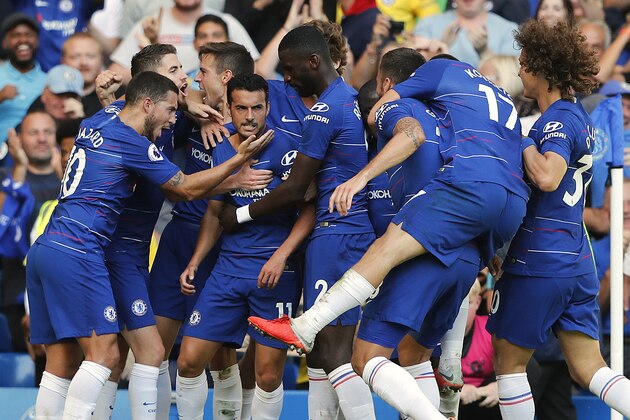 Chelsea's Pedro, center, celebrates with teammates after scoring his side's first goal during the English Premier League soccer match between Chelsea and Bournemouth at Stamford Bridge stadium in London, Saturday, Sept. 1, 2018.(AP Photo/Frank Augstein)
