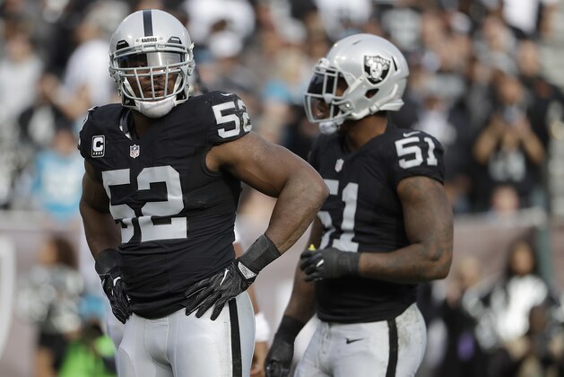 Oakland Raiders defensive end Khalil Mack (52) and outside linebacker Bruce Irvin (51) during the first half of an NFL football game against the Carolina Panthers in Oakland, Calif., Sunday, Nov. 27, 2016. (AP Photo/Marcio Jose Sanchez)