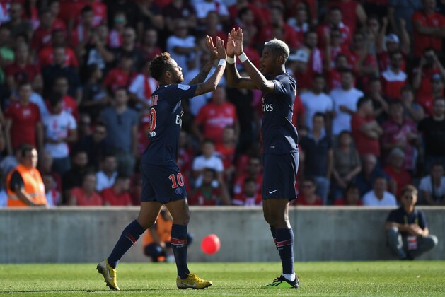 Paris Saint-Germain's Brazilian forward Neymar (L) celebrates with Paris Saint-Germain's French defender Presnel Kimpembe after scoring the opener during the French L1 football match between Nimes and Paris Saint-Germain (PSG), on September 1, 2018 at the Costieres stadium in Nimes, southern France. (Photo by Pascal GUYOT / AFP)        (Photo credit should read PASCAL GUYOT/AFP/Getty Images)
