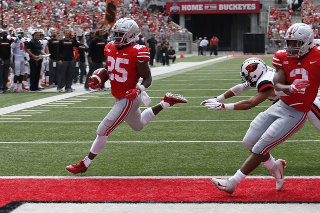 Ohio State running back Mike Weber, left, scores a touchdown against Oregon State during the first half of an NCAA college football game Saturday, Sept. 1, 2018, in Columbus, Ohio. (AP Photo/Jay LaPrete)