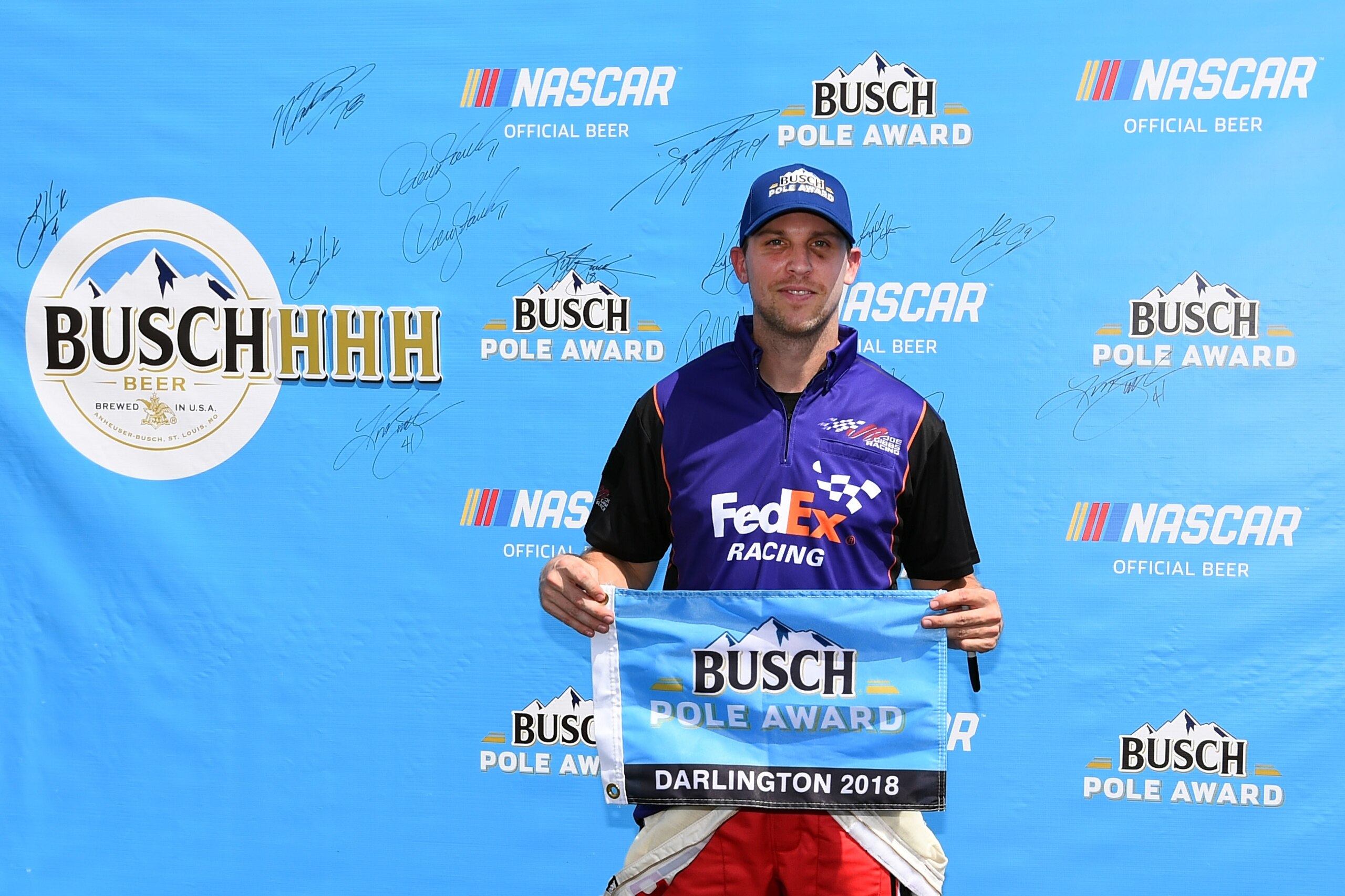 DARLINGTON, SC - SEPTEMBER 01:  Denny Hamlin, driver of the #11 FedEx Throwback Toyota, poses with the Busch Pole Award after qualying on the pole position during qualifying for the Monster Energy NASCAR Cup Series Bojangles' Southern 500 at Darlington Raceway on September 1, 2018 in Darlington, South Carolina.  (Photo by Josh Hedges/Getty Images)