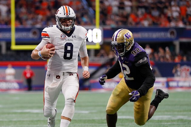 ATLANTA, GA - SEPTEMBER 01:  Jarrett Stidham #8 of the Auburn Tigers rushes away from Jaylen Johnson #92 of the Washington Huskies at Mercedes-Benz Stadium on September 1, 2018 in Atlanta, Georgia.  (Photo by Kevin C. Cox/Getty Images)