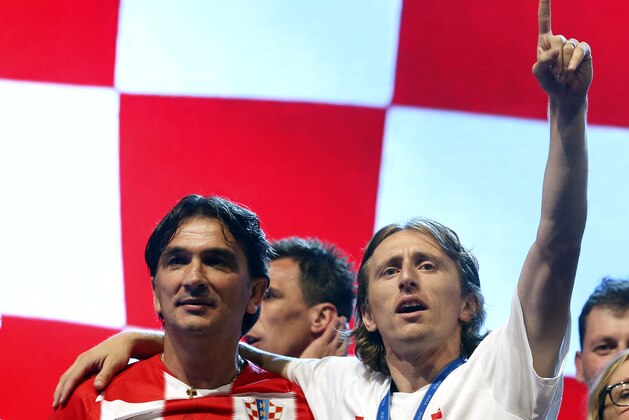 Croatia head coach Zlatko Dalic, left, and Croatia's player Luka Modric celebrate upon arrival in Zagreb, Croatia, Monday, July 16, 2018. Euphoria gave way to a mixture of disappointment and pride for Croatia fans after their national team lost to France in its first ever World Cup final. (AP Photo/Darko Vojinovic)