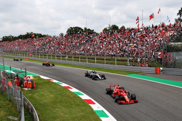 MONZA, ITALY - SEPTEMBER 02: Kimi Raikkonen of Finland driving the (7) Scuderia Ferrari SF71H leads Lewis Hamilton of Great Britain driving the (44) Mercedes AMG Petronas F1 Team Mercedes WO9 on track during the Formula One Grand Prix of Italy at Autodromo di Monza on September 2, 2018 in Monza, Italy.  (Photo by Charles Coates/Getty Images)