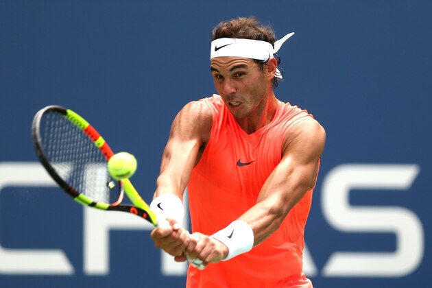 NEW YORK, NY - SEPTEMBER 02:  Rafael Nadal of Spain returns the ball during his men's singles fourth round match against Nikoloz Basilashvili of Georgia on Day Seven of the 2018 US Open at the USTA Billie Jean King National Tennis Center on September 2, 2018 in the Flushing neighborhood of the Queens borough of New York City.  (Photo by Alex Pantling/Getty Images)